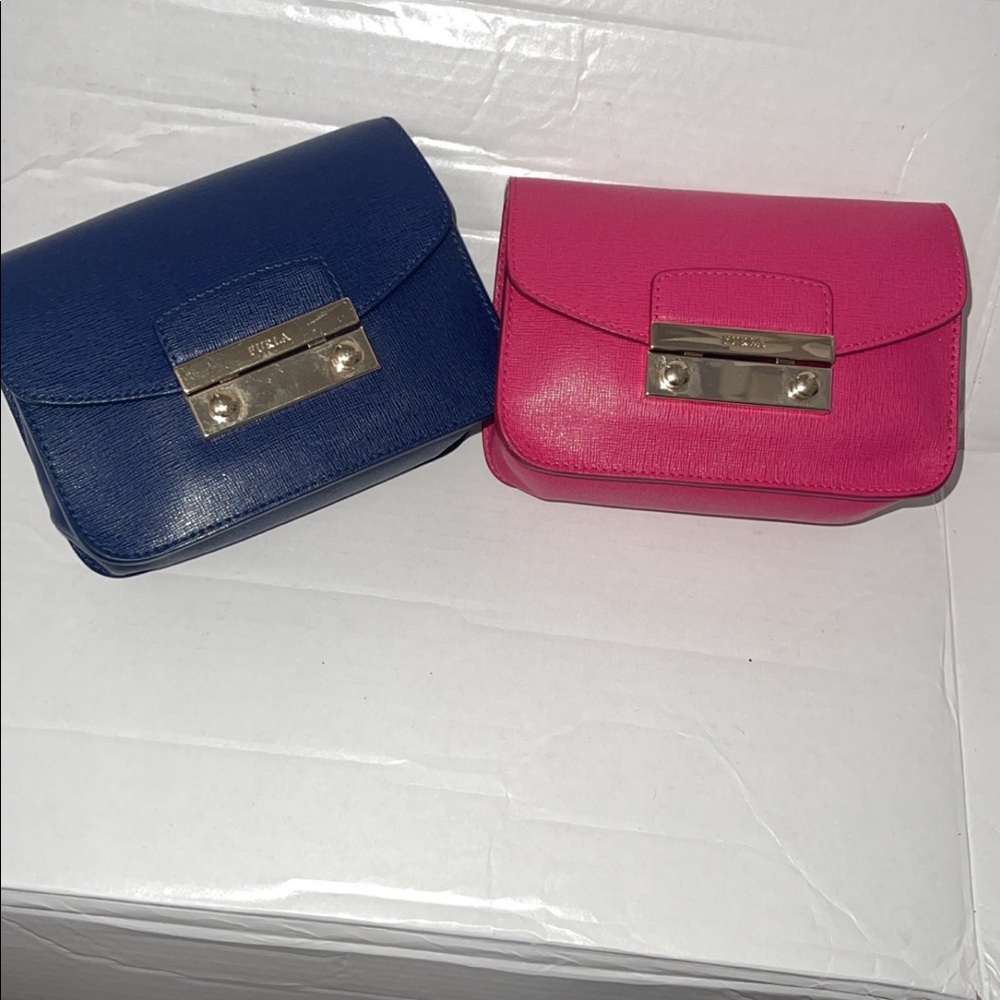 Navy Blue Furl mini Crossbody bags. Priced @ $100